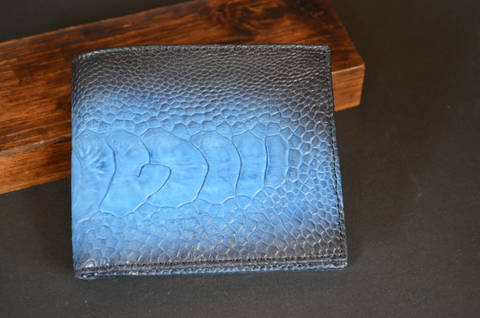 ROMA - OSTRICH LEG 4 LIGHT BLUE is one of our hand crafted wallets, made using ostrich leg matte & calfskin / textil in the interior. Available in light blue color.