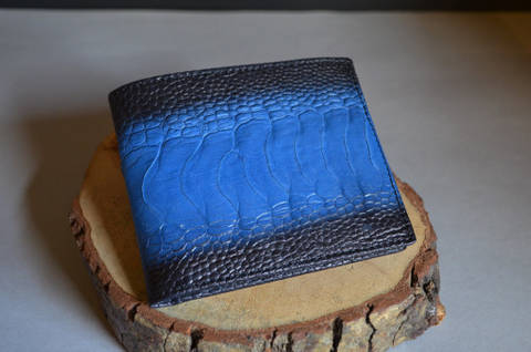 FIRENZE - OSTRICH LEG 15 BLUE FANTASY is one of our hand crafted wallets, made using ostrich leg matte & calfskin / textil in the interior. Available in blue fantasy color.