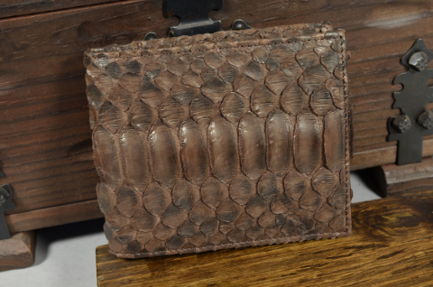 ROMA - PYTHON 17 VINTAGE BROWN MATTE is one of our hand crafted wallets, made using python belly matte & calfskin / textil in the interior. Available in vintage brown color.