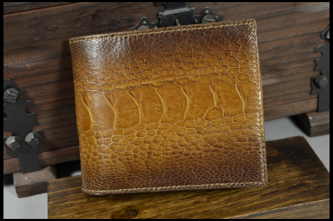 ROMA - OSTRICH LEG 22 WALNUT is one of our hand crafted wallets, made using ostrich leg matte & calfskin / textil in the interior. Available in walnut color.